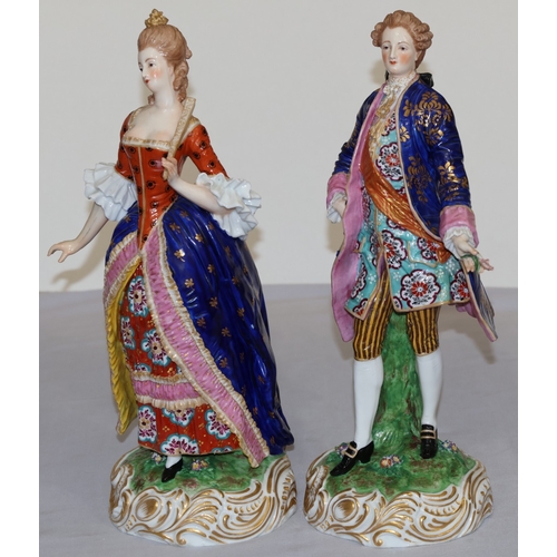 73 - A pair of large Derby style 19th Century porcelain figure of standing gentleman and lady with allove... 