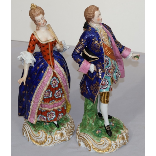 73 - A pair of large Derby style 19th Century porcelain figure of standing gentleman and lady with allove... 
