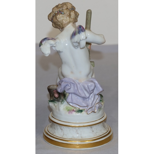 74 - A Meissen porcelain figure of a seated winged cupid pressing 2 hearts together, on round sweeping ba... 