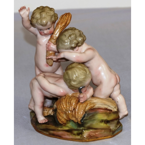 75 - A Meissen group of 3 cupids playing with wheat, 15cm high