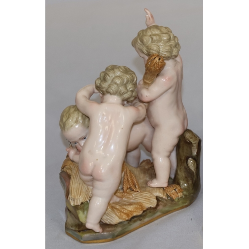 75 - A Meissen group of 3 cupids playing with wheat, 15cm high