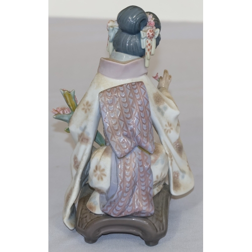 78 - A Lladro figure of a kneeling Oriental lady with encrusted floral decoration, 17.5cm high
