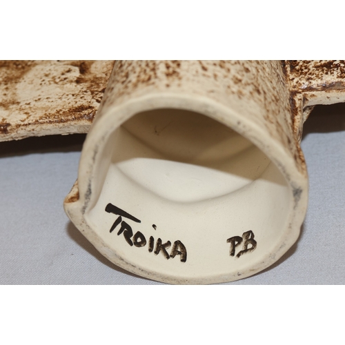 83 - A Troika Pottery Aztec double-sided face mask, moulded in high relief by Penny Black on cream, green... 
