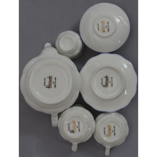 85 - 3 Coalport miniature cups and saucers with floral decoration and a Harrods miniature tea service on ... 