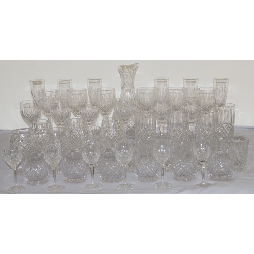 93 - A Stuart crystal suite of drinking glasses, comprising of carafe, 6 champagne flutes, 6 red wine gla... 