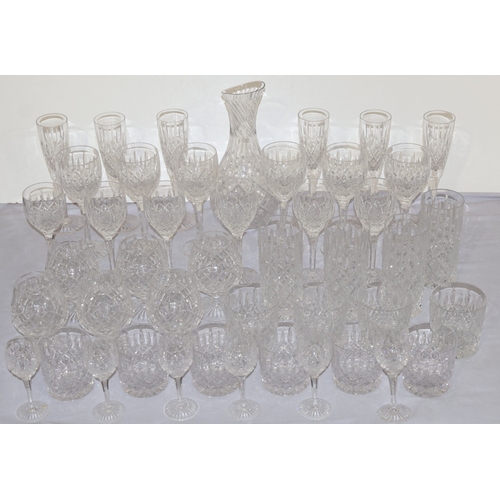 93 - A Stuart crystal suite of drinking glasses, comprising of carafe, 6 champagne flutes, 6 red wine gla... 