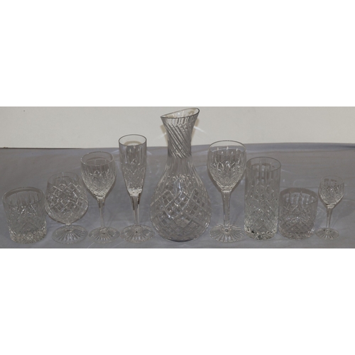 93 - A Stuart crystal suite of drinking glasses, comprising of carafe, 6 champagne flutes, 6 red wine gla... 