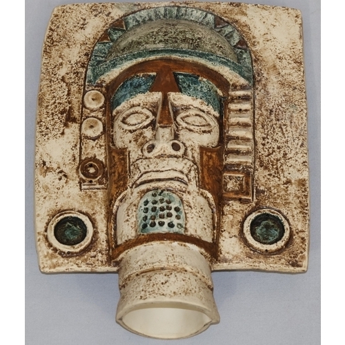 83 - A Troika Pottery Aztec double-sided face mask, moulded in high relief by Penny Black on cream, green... 