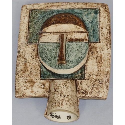 83 - A Troika Pottery Aztec double-sided face mask, moulded in high relief by Penny Black on cream, green... 