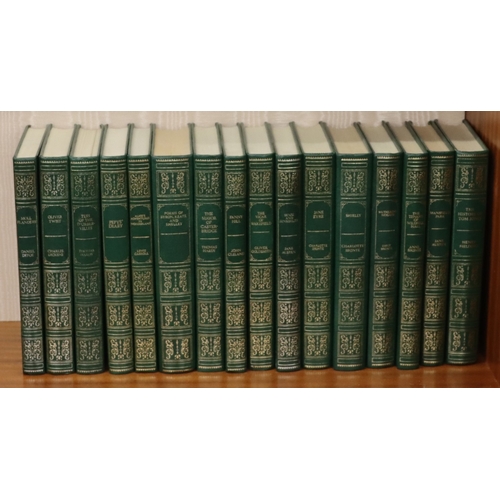 9010 - A set of 24 Guild Publishing books with green faux leather covers and ornate decoration, authors inc... 
