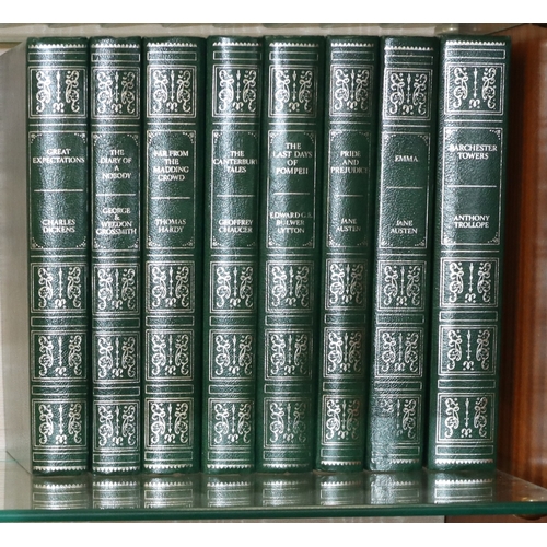 9010 - A set of 24 Guild Publishing books with green faux leather covers and ornate decoration, authors inc... 