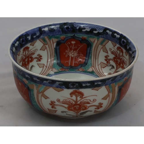 95 - A 19th Century Imari small round bulbous bowl on white, blue, green and red ground with floral, leaf... 