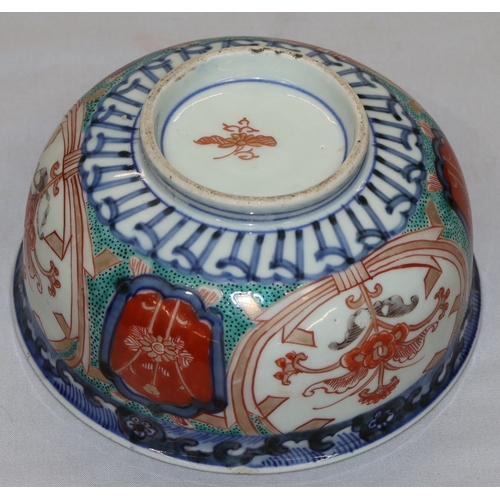 95 - A 19th Century Imari small round bulbous bowl on white, blue, green and red ground with floral, leaf... 