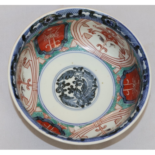 95 - A 19th Century Imari small round bulbous bowl on white, blue, green and red ground with floral, leaf... 