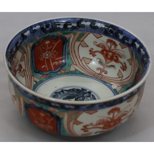 95 - A 19th Century Imari small round bulbous bowl on white, blue, green and red ground with floral, leaf... 