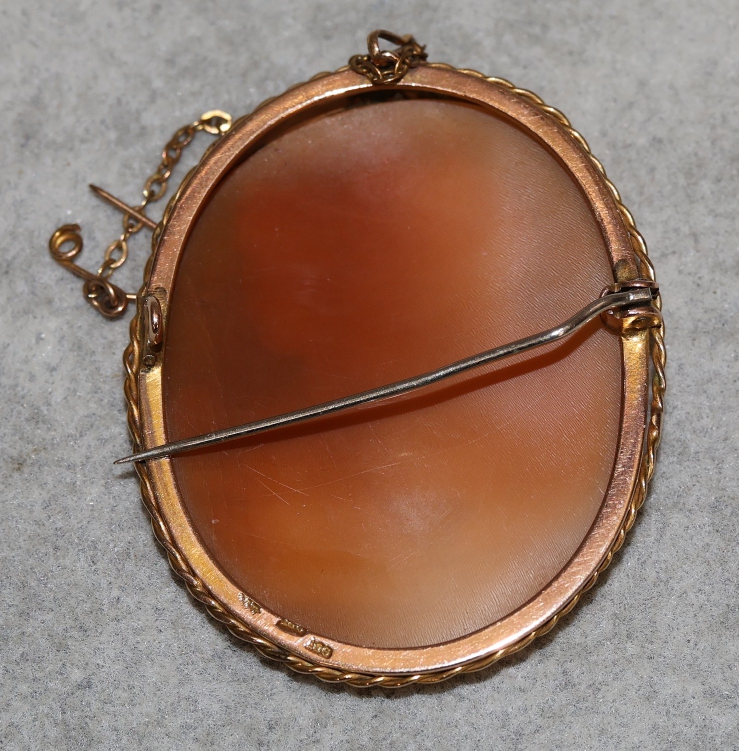 A 9ct gold oval cameo depicting various figureheads and eagle motif, in ...