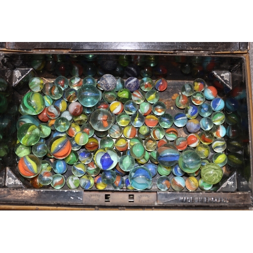 A quantity of various vintage marbles in a vintage cash tin (handle ...