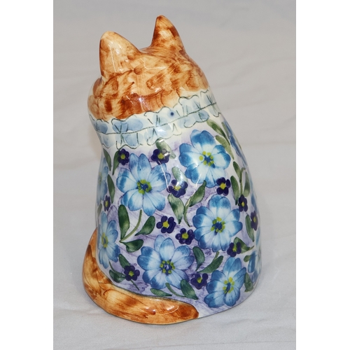 17 - Joan De Bethel, Cinque Ports Pottery seated cat figure wearing blue floral jacket, 12.5cm high