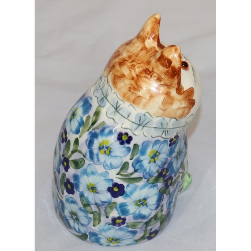 17 - Joan De Bethel, Cinque Ports Pottery seated cat figure wearing blue floral jacket, 12.5cm high
