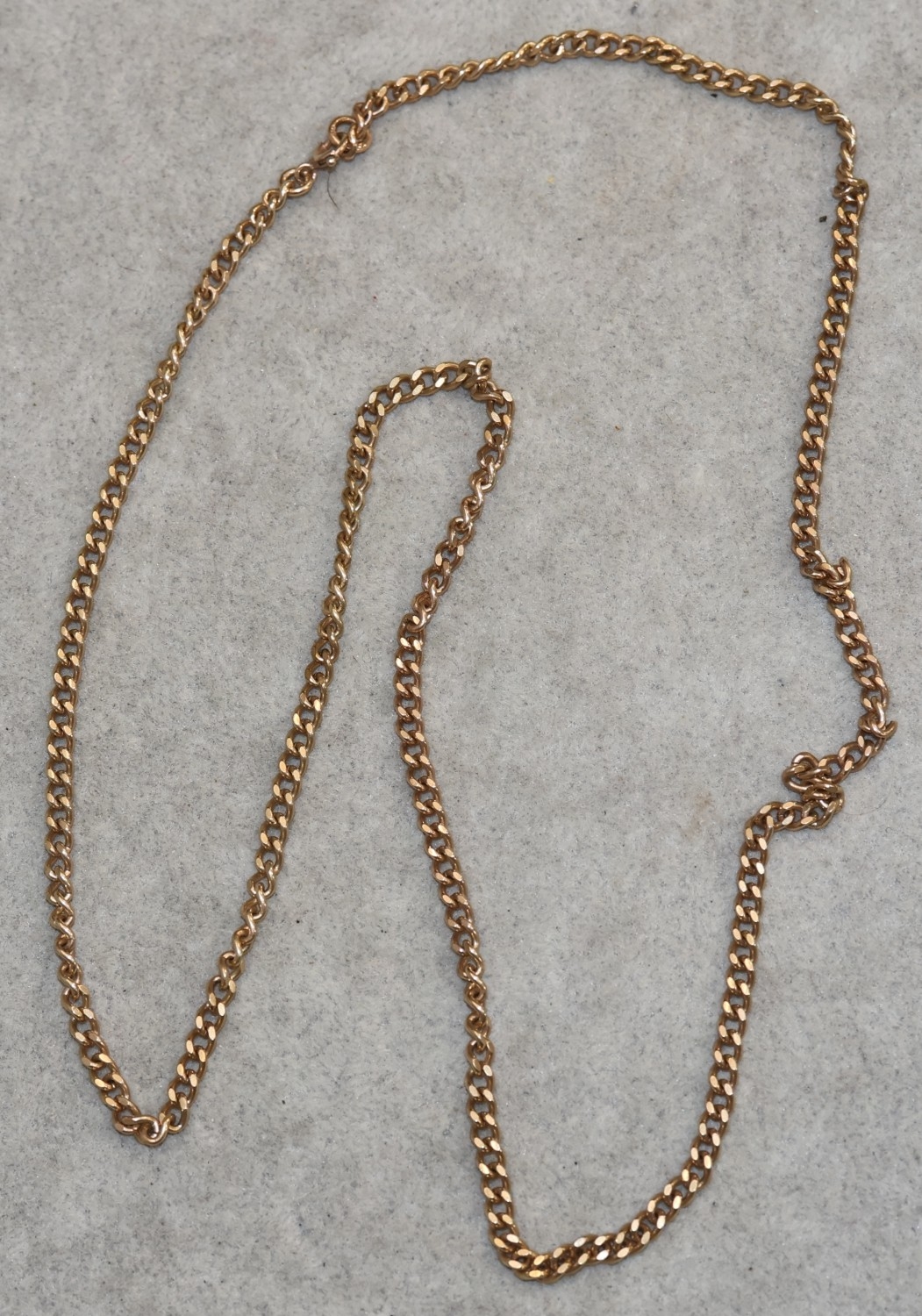 A 9ct flat gold chain, 61cm long, 16.7 grams
