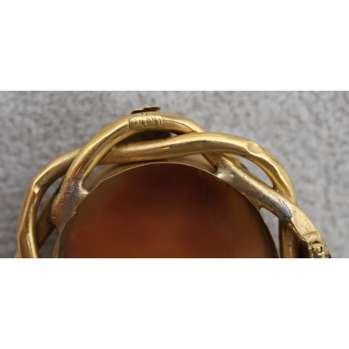 A 9ct gold oval cameo with pierced frame, depicting figurehead of a ...