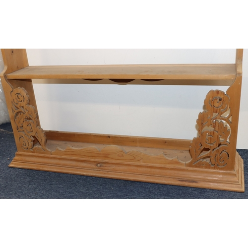 3007 - A pine hanging bookshelf, 112cm wide, 25cm deep, 115cm high. (Some stains to shelves).
