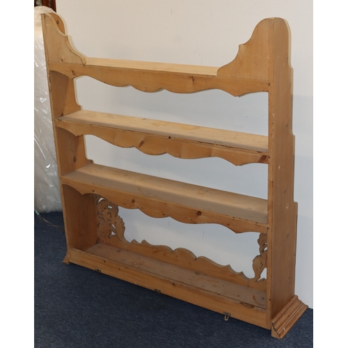 3007 - A pine hanging bookshelf, 112cm wide, 25cm deep, 115cm high. (Some stains to shelves).