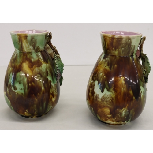 3013 - A pair of Majolica vases, 20cm high. (1 rose petal damaged, 3 leaves damaged and 1 chip to 1 leaf).