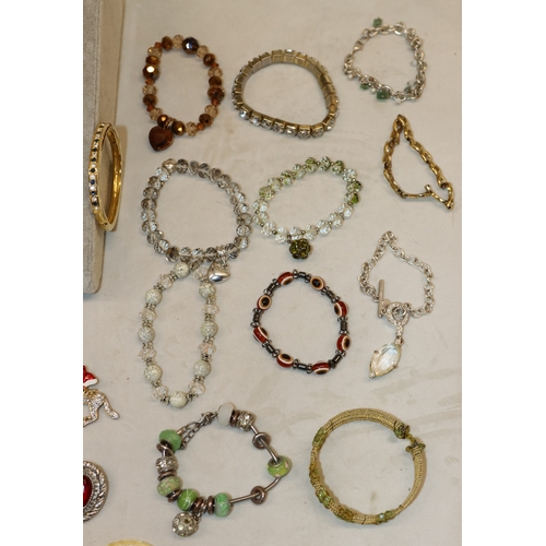 3022 - A quantity of various costume jewellery earrings, bracelets and brooches.