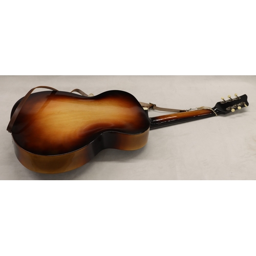 3023 - An acoustic Voss guitar with leather strap, various music books, spare strings and hard case (wear t... 