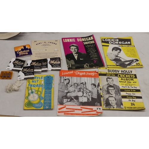 3023 - An acoustic Voss guitar with leather strap, various music books, spare strings and hard case (wear t... 