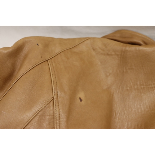 3025 - A tan leather gentleman's jacket, 82cm long, shoulder to cuff 70cm size 50. (2 dark spots to back).