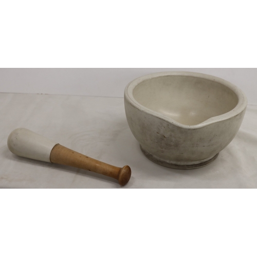 3032 - A large stone pestle and mortar, 29cm diameter, 15.5cm high, pestle, 31cm long.