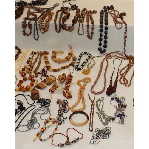 3038 - A large quantity of costume jewellery necklaces and some bangles etc.