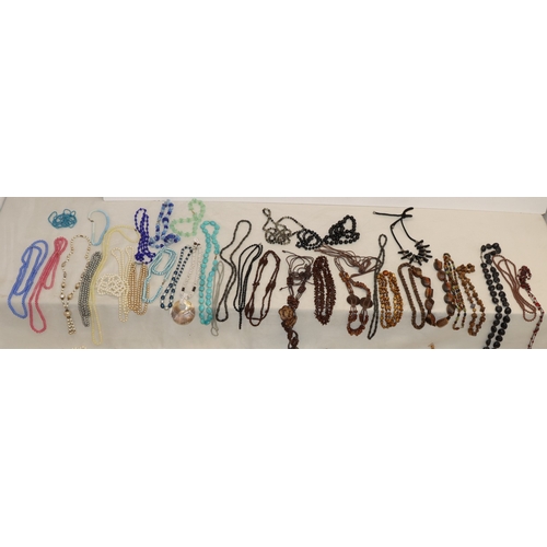 3038 - A large quantity of costume jewellery necklaces and some bangles etc.