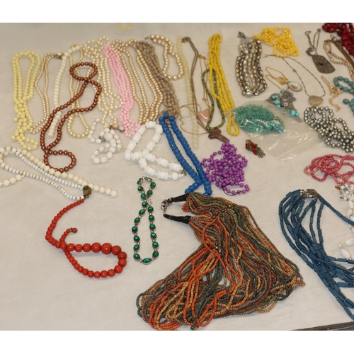 3038 - A large quantity of costume jewellery necklaces and some bangles etc.