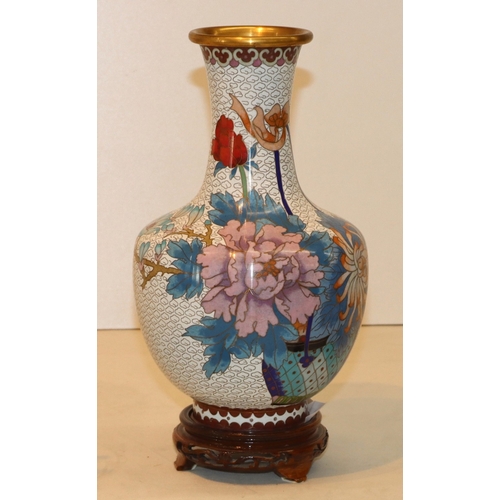 3041 - A Cloisonne vase, 26cm high, with Oriental wood stand, an Oriental soapstone figure, 10cm high, a sm... 