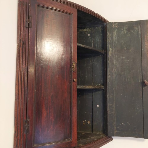 3009 - THIS LOT IS NOT HELD BY PFW. A 19th century small bow fronted corner cupboard, 70cm wide, 37cm deep,... 