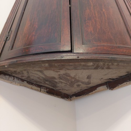 3009 - THIS LOT IS NOT HELD BY PFW. A 19th century small bow fronted corner cupboard, 70cm wide, 37cm deep,... 