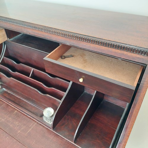 3011 - THIS LOT IS NOT HELD BY PFW. A mahogany bureau, 3 drawers, interior writing slope with leather inser... 