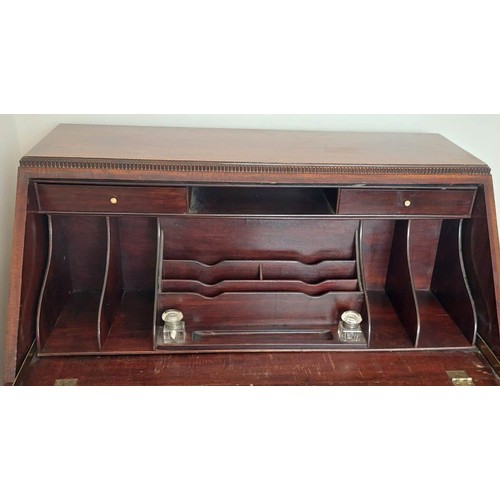 3011 - THIS LOT IS NOT HELD BY PFW. A mahogany bureau, 3 drawers, interior writing slope with leather inser... 