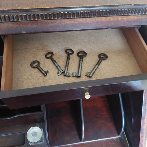 3011 - THIS LOT IS NOT HELD BY PFW. A mahogany bureau, 3 drawers, interior writing slope with leather inser... 