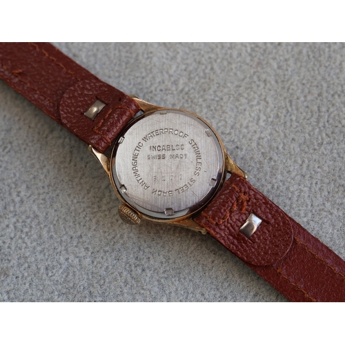 614 - A Leica ladies' circular wristwatch with seconds hand and Arabic numerals, leather strap bracelet (w... 