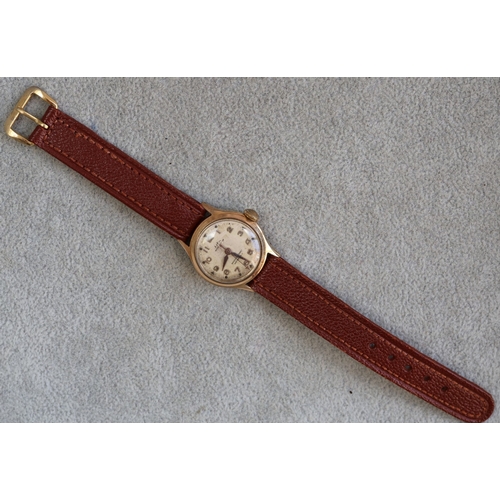 614 - A Leica ladies' circular wristwatch with seconds hand and Arabic numerals, leather strap bracelet (w... 