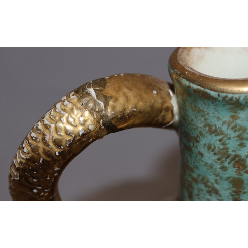 143 - A Bonn glazed china round bulbous thin necked jug with serpent handle, on white and green ground wit... 