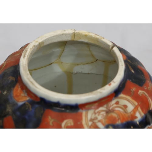 179 - A set of 3 Imari round bulbous melon shaped lidded pots with allover tree, floral, leaf and gilt dec... 