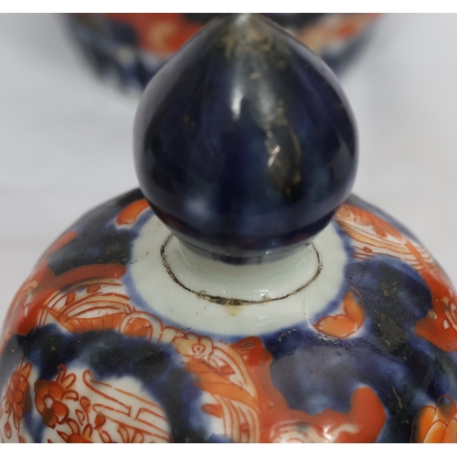 179 - A set of 3 Imari round bulbous melon shaped lidded pots with allover tree, floral, leaf and gilt dec... 