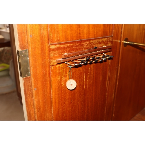 3195 - THIS ITEM IS NOT HELD BY PFW. An early 20th century Maple & Co triple wardrobe with central drawers ... 