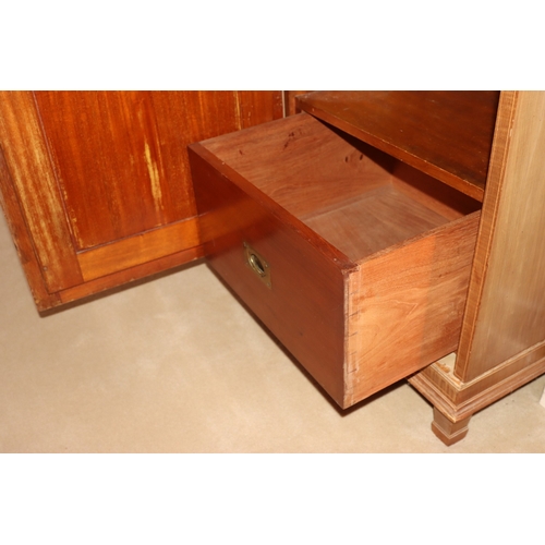3195 - THIS ITEM IS NOT HELD BY PFW. An early 20th century Maple & Co triple wardrobe with central drawers ... 