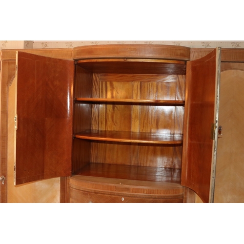 3195 - THIS ITEM IS NOT HELD BY PFW. An early 20th century Maple & Co triple wardrobe with central drawers ... 